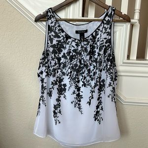 Black and white lined sleeveless blouse